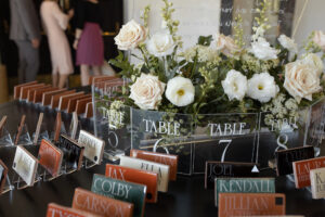 white flowers wedding escort card table